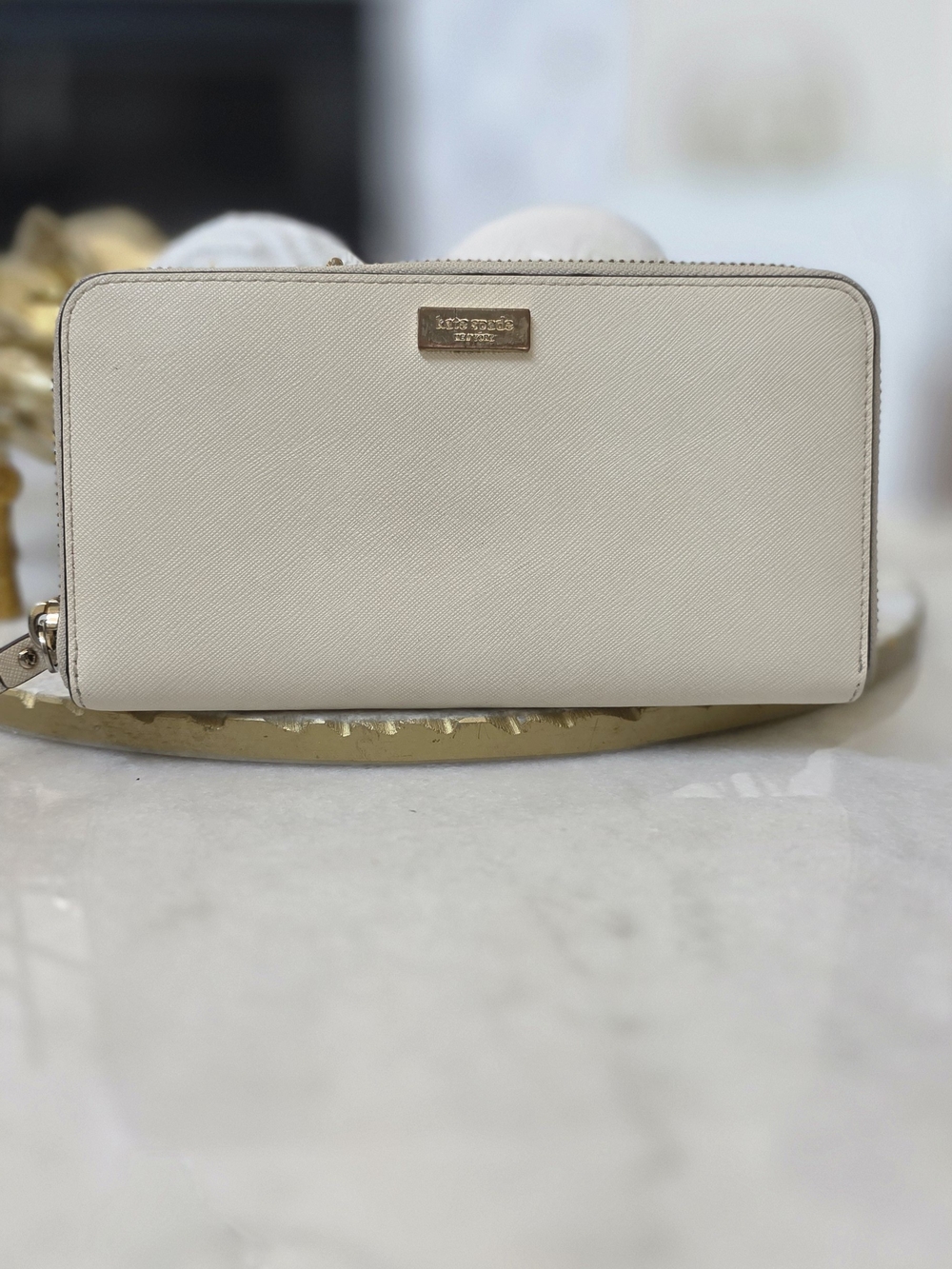 Kate Spade Newbury Lane Neda Zip Around Wallet in Cream Saffiano Leather.